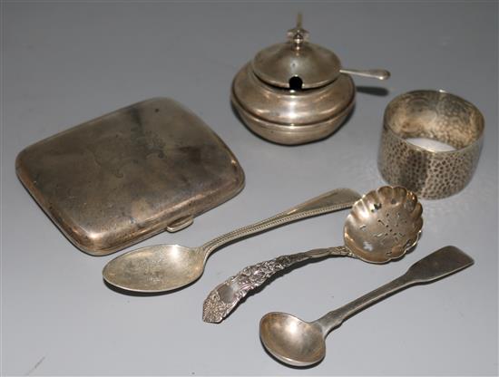 A silver cigarette case, a mustard pot, a napkin ring and three assorted spoons.